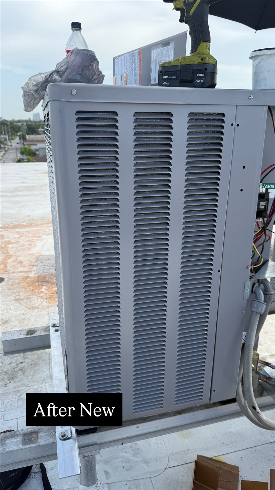 Commercial rooftop air-conditioning equipment being serviced